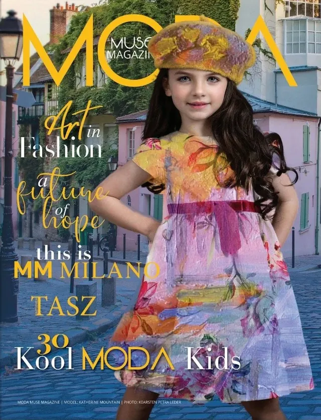 Cover of MODA Muse Magazine: a young girl in a painterly floral dress and beret on a cobbled street, under a yellow MODA masthead.
